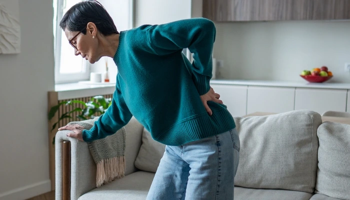 Doctor consulting a patient about back pain